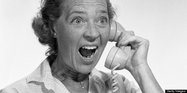 Mature woman yelling on telephone