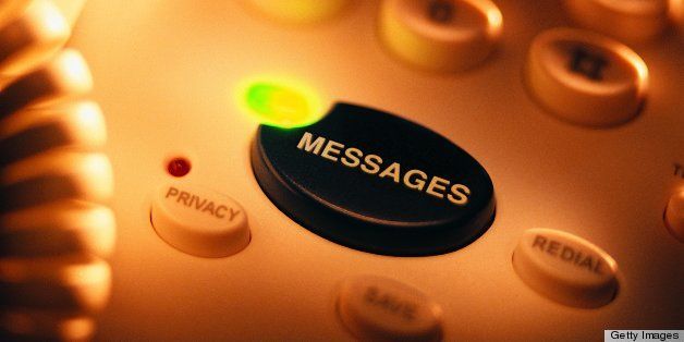 Closeup of lit message button on telephone
