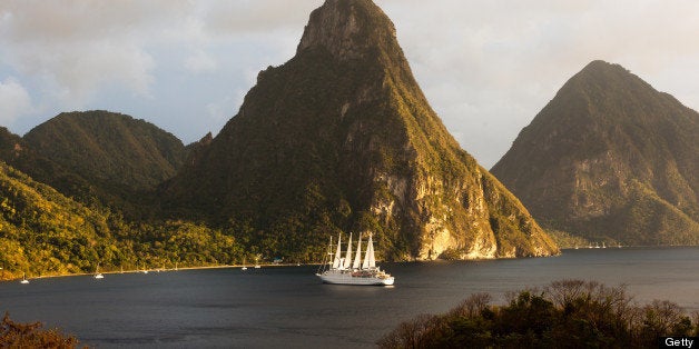 The World Heritage Twin Pitons framed by beautiful huge five-masted sailing ship 'Club Med 2'.