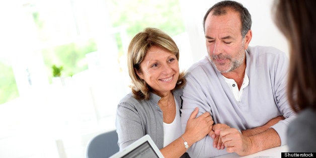 senior couple ready to buy new...