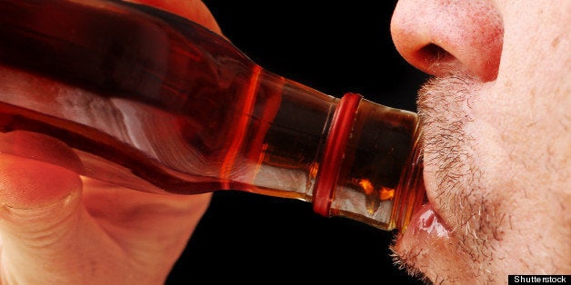 close up of a man drinking hard ...