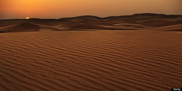 Sunset landscape in dry sand dunes near Dubai.