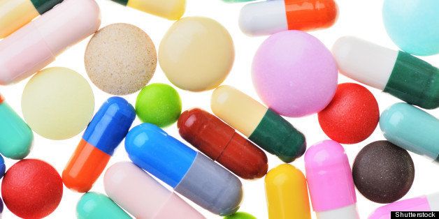 many colorful pills isolated on ...