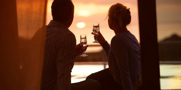 couple sat drinking and watching sunset