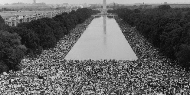 Photograph of crowd gathered with Washington Monument in background in Washington DC circa 1964, when Martin Luther King gave