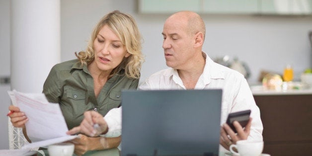 Couple paying their bills at home