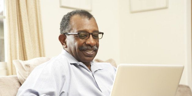 senior man using laptop at home