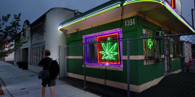 A pedestrians walks past the Little Green Pharmacy medical cannabis dispensary in Denver, Colorado, on Tuesday, August 2, 2011. (Randall Benton/Sacramento Bee/MCT via Getty Images)