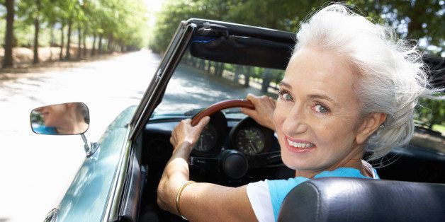 senior woman in sports car