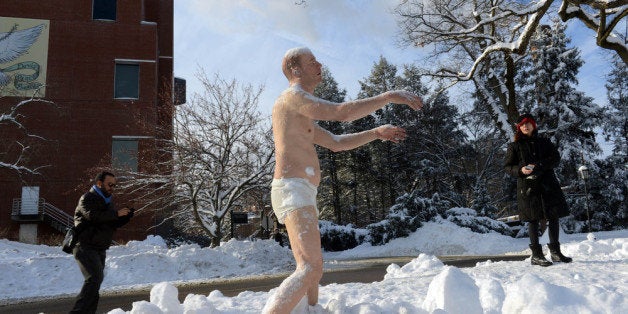 WELLESLEY - FEBRUARY 6: People look at a sculpture entitled 'Sleepwalker' on the campus of Wellesley College February 6, 2014 in Wellesley, Massachusetts. The sculpture is part of an exhibit by artist Tony Matelli at the college's Davis Museum, and has prompted an online student petition to have it removed due to its edgy nature. (Photo by Darren McCollester/Getty Images)