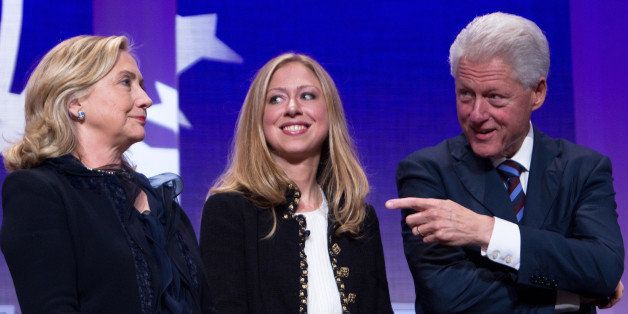 NEW YORK CITY- SEPTEMBER 22: Former US President Bill Clinton (R) stands on stage with his wife Hillary Rodham Clinton (L), Secretary of State, and their daughter Chelsea Clinton during the closing Plenary session of the seventh Annual Meeting of the Clinton Global Initiative (CGI) at the Sheraton New York Hotel on September 22, 2011 in New York City. Established in 2005 by former U.S. President Bill Clinton, the CGI assembles global leaders to develop and implement solutions to some of the world's most urgent problems. (Photo by Daniel Berehulak/Getty Images)