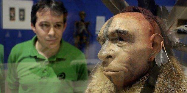 A visitor looks at 'El Neandertal Emplumado', a scientificly based impression of the face of a Neanderthal who lived some 50,000 years ago by Italian scientist Fabio Fogliazza during the inauguration of the exhibition 'Cambio de Imagen' (Change of Image) at the Museum of Human Evolution in Burgos on June 10, 2014. AFP PHOTO / CESAR MANSO (Photo credit should read CESAR MANSO/AFP/Getty Images)