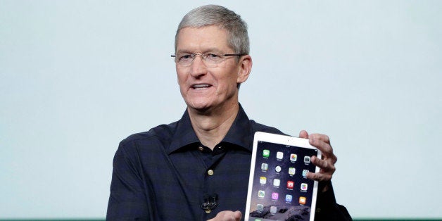 Apple CEO Tim Cook introduces the new Apple iPad Air 2 during an event at Apple headquarters on Thursday, Oct. 16, 2014 in Cu