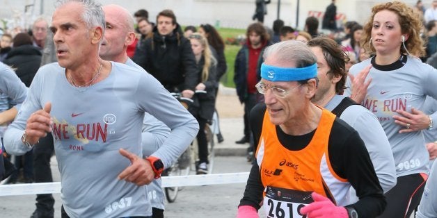 ROME, ITALY - DECEMBER 31: Runners take the streets for the 'We Run Rome 2013' race on the last day of the year on December