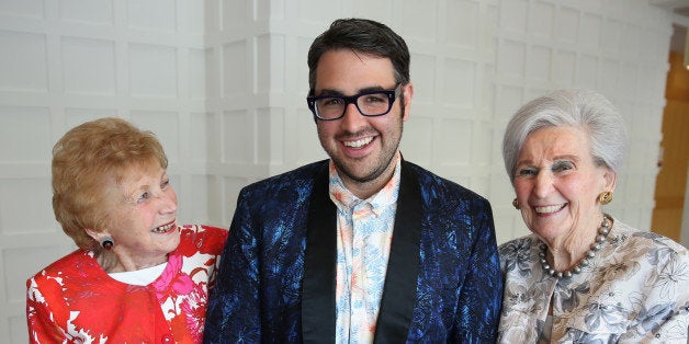 CANTON, MA - MAY 8: At Orchard Cove, Letty Zander, 96, left; Ari Seth Cohen, author of 'Advanced Style,' middle; and Sylvia Carle, 97, right, in Canton. Cohen was visiting Orchard Cove to show his photography work on seniors. (Photo by Jonathan Wiggs/The Boston Globe via Getty Images)