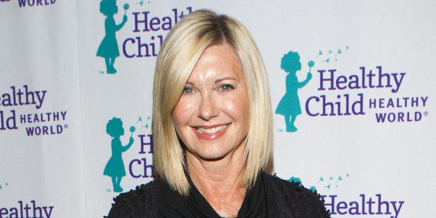 LOS ANGELES, CA - OCTOBER 29: Olivia Newton-John arrives at Healthy Child Healthy World 'Mom On A Mission GALA' 2014 on October 29, 2014 in Los Angeles, California. (Photo by Michael Bezjian/WireImage)