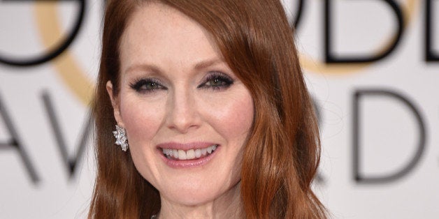 Julianne Moore arrives at the 72nd annual Golden Globe Awards at the Beverly Hilton Hotel on Sunday, Jan. 11, 2015, in Beverly Hills, Calif. (Photo by John Shearer/Invision/AP)