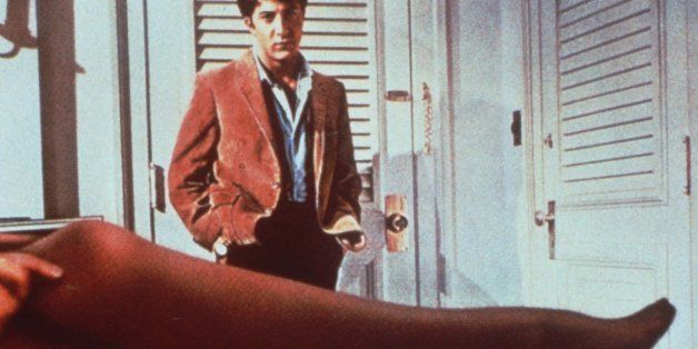 Dustin Hoffman looks over the stockinged leg of actress Anne Bancroft, his seductress in this scene from the 1967 film "The Graduate." The movie, which is being reissued to theaters in a fresh print, won an Oscar for its director, Mike Nichols. (AP Photo/ho)