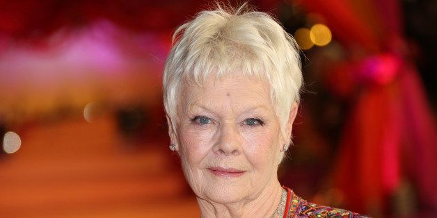 Actress Dame Judi Dench arrives for the World Premiere of The Second Best Exotic Marigold Hotel at a central London cinema in Leicester Square, Tuesday, Feb. 17, 2015. (Photo by Joel Ryan/Invision/AP)