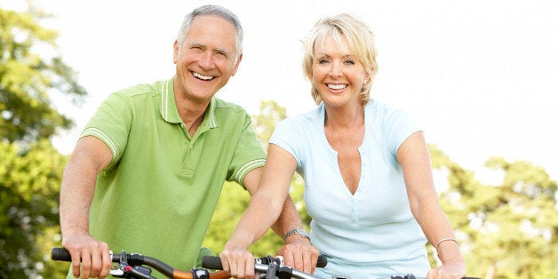 Mature couple riding bikes