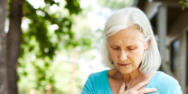 A senior woman experiencing chest pain.