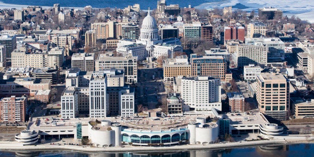 An aerial photo of Madison, Wisconsin in the winter. Pictured is Monona Terrace, the state capital and downtown buildings