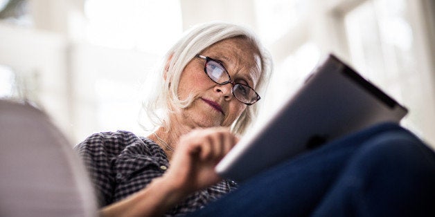 senior woman using tablet