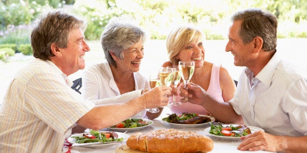 Friends Eating An Al Fresco Lunch, Holding Wineglasses