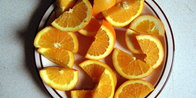 Navel orange slices on a plate.