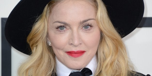 Madonna arrives at the 56th annual GRAMMY Awards at Staples Center on Sunday, Jan. 26, 2014, in Los Angeles. (Photo by Jordan Strauss/Invision/AP)