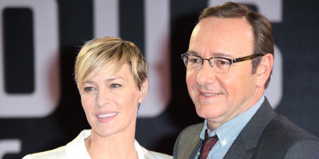 Actors Kevin Spacey and Robin Wright pose for photographers upon arrival at the House of Cards season 3 World Premiere at the