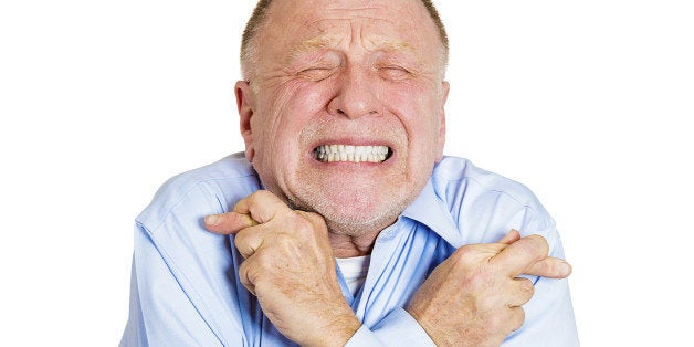 Closeup portrait of senior mature man crossing fingers wishing and praying for miracle, hoping for the best, isolated on white background. Positive human emotion facial expression feelings attitude