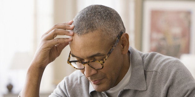 Mixed race man using digital tablet