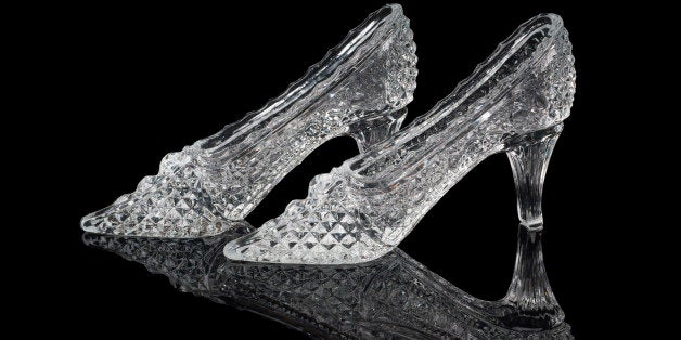 Pair of woman crystal shoes on the black background