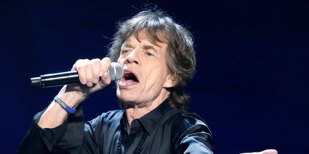 Mick Jagger of the Rolling Stones performs in concert at the TD Garden arena on Wednesday, June 12, 2013 in Boston. (Photo by Bizuayehu Tesfaye/Invision/AP)