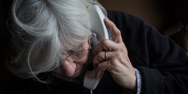 BRISTOL, ENGLAND - FEBRUARY 16: In this photo illustration an elderly person uses a telephone on February 16, 2015 near Bristol, England. The issues affecting the elderly, along with education and the economy are likely to be key elections issues in the forthcoming general election in May. (Photo by Matt Cardy/Getty Images)