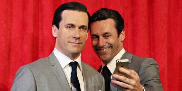 NEW YORK, NY - MAY 09: Actor Jon Hamm takes a selfie as he unveils Don Draper's wax figure during Mad Men's Final Season at