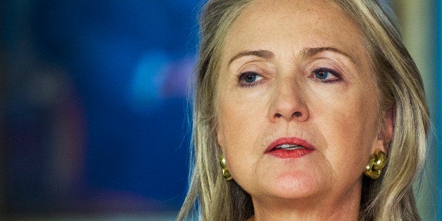 US Secretary of State Hillary Clinton responds to questions from the media regarding US embassies during a brief press confer