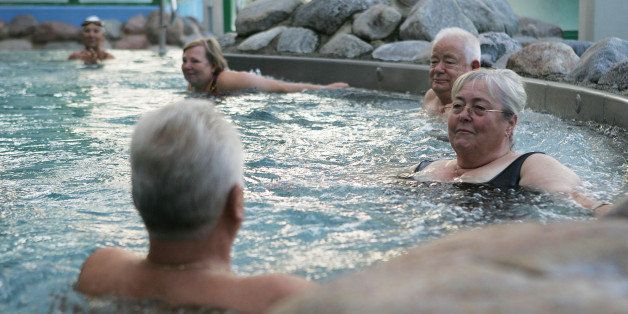 RUESSELSHEIM, GERMANY - SEPTEMBER 03: Elderly people rest in a public swimming pool on September 3, 2005 in Ruesselsheim, Germany. Germany's economy and pension system is being burdened by an expanding elderly population, and German politians are offering various solutions ahead of the elections on September 18. (Photo by Ralph Orlowski/Getty Images)