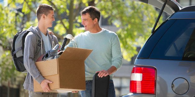 USA, New Jersey, Jersey City, Father helping teenage son (16-17) packing to college