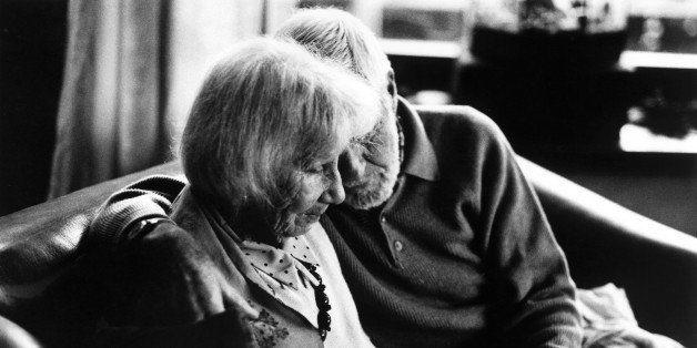 Husband tending to his wife who is afflicted with Alzheimer's disease. Zurich, Switzerland.