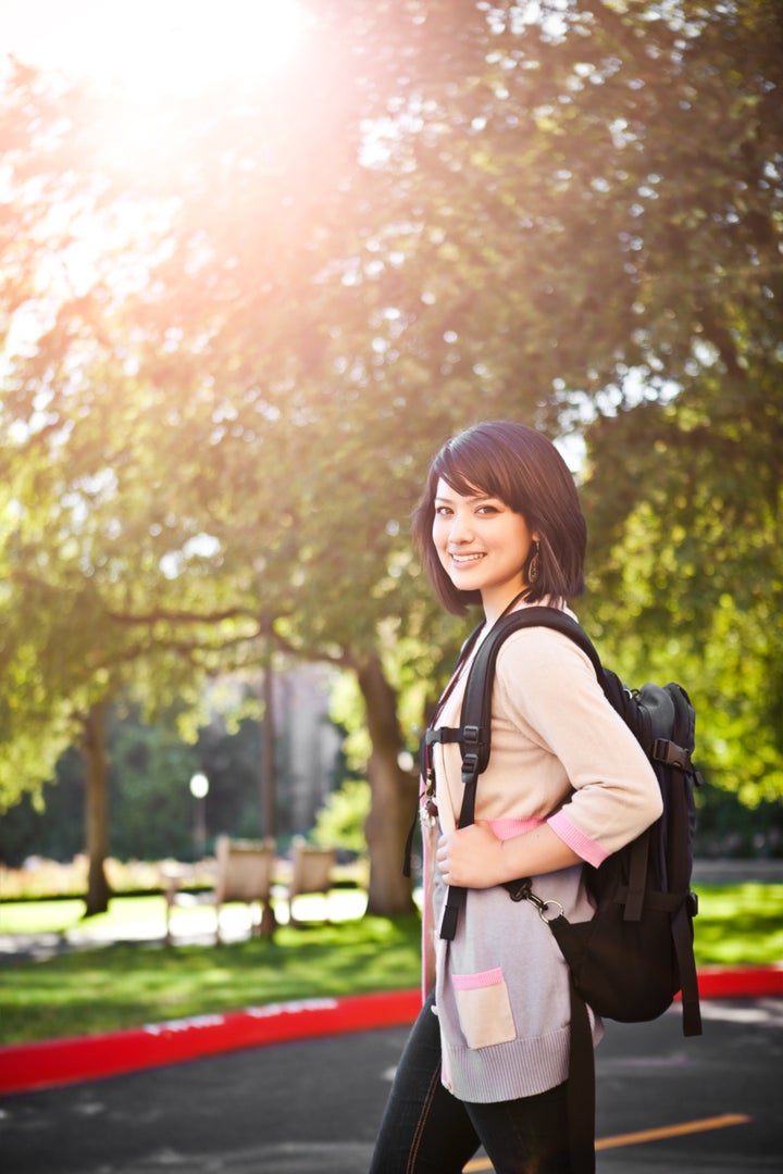 A portrait of a mixed race college student at campus