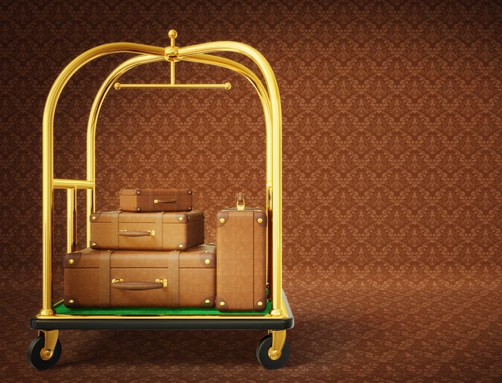 brown suitcase isolated on a brown background