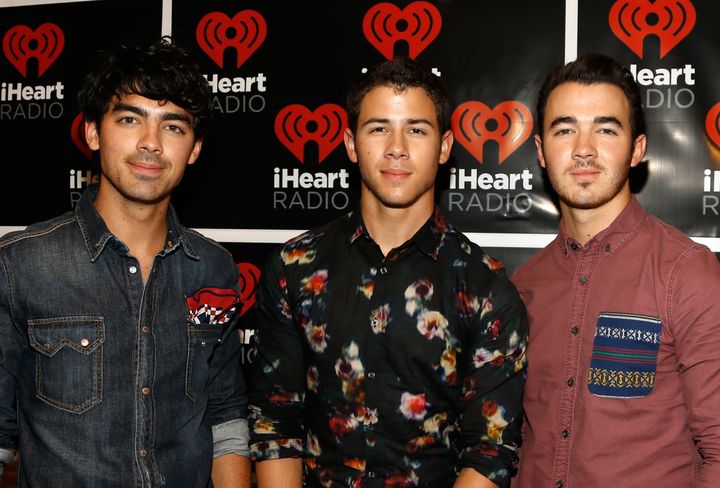 LAS VEGAS, NV - SEPTEMBER 22: Singers Joe Jonas, Nick Jonas, and Kevin Jonas of The Jonas Brothers pose backstage during the 2012 iHeartRadio Music Festival at the MGM Grand Garden Arena on September 22, 2012 in Las Vegas, Nevada. (Photo by Isaac Brekken/Getty Images for Clear Channel)