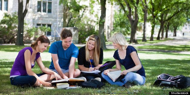 College students studying together in campus ground