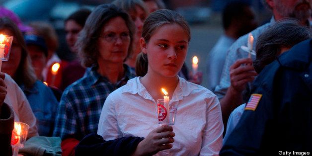 PITTSBURGH, PA - APRIL 16: Anti-violence protestors hold a candlelight vigil in front of the David L. Lawrence Convention Center April 16, 2004 in Pittsburgh, Pennsylvania. The protestors held the vigil in order to speak out against gun related violence in front of the National Rifle Association's 133rd Annual Convention. (Photo by Jeff Swensen/Getty Images)