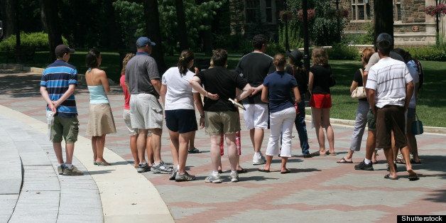 group of people taking tour of university