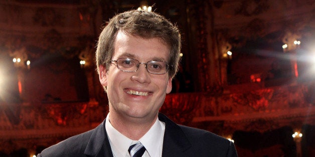 MUNICH, GERMANY - NOVEMBER 23: Author John Green poses with the award after the award ceremony of the Corine book award on N