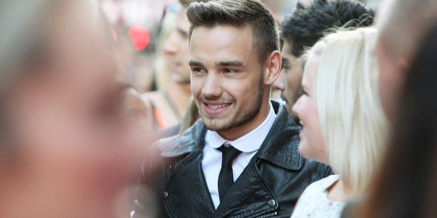 LONDON, ENGLAND - AUGUST 20: (EMBARGOED FOR PUBLICATION IN UK TABLOID NEWSPAPERS UNTIL 48 HOURS AFTER CREATE DATE AND TIME. MANDATORY CREDIT PHOTO BY DAVE M. BENETT/WIREIMAGE REQUIRED) Liam Payne (C) attends the World Premiere of 'One Direction: This Is Us 3D' at Empire Leicester Square on August 20, 2013 in London, England. (Photo by Dave M. Benett/WireImage)