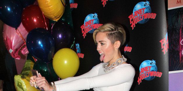 NEW YORK, NY - OCTOBER 08: Miley Cyrus attends her Miley Cyrus 'Bangerz' Record Release Signing at Planet Hollywood Times Square on October 8, 2013 in New York City. (Photo by Bruce Glikas/FilmMagic)